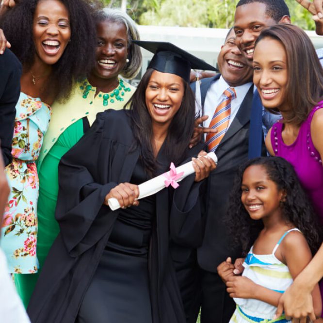 student graduating with family