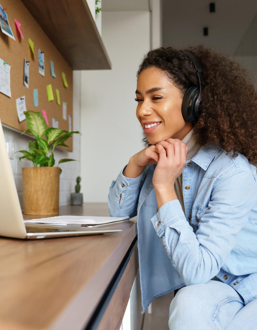student looking at computer smiling