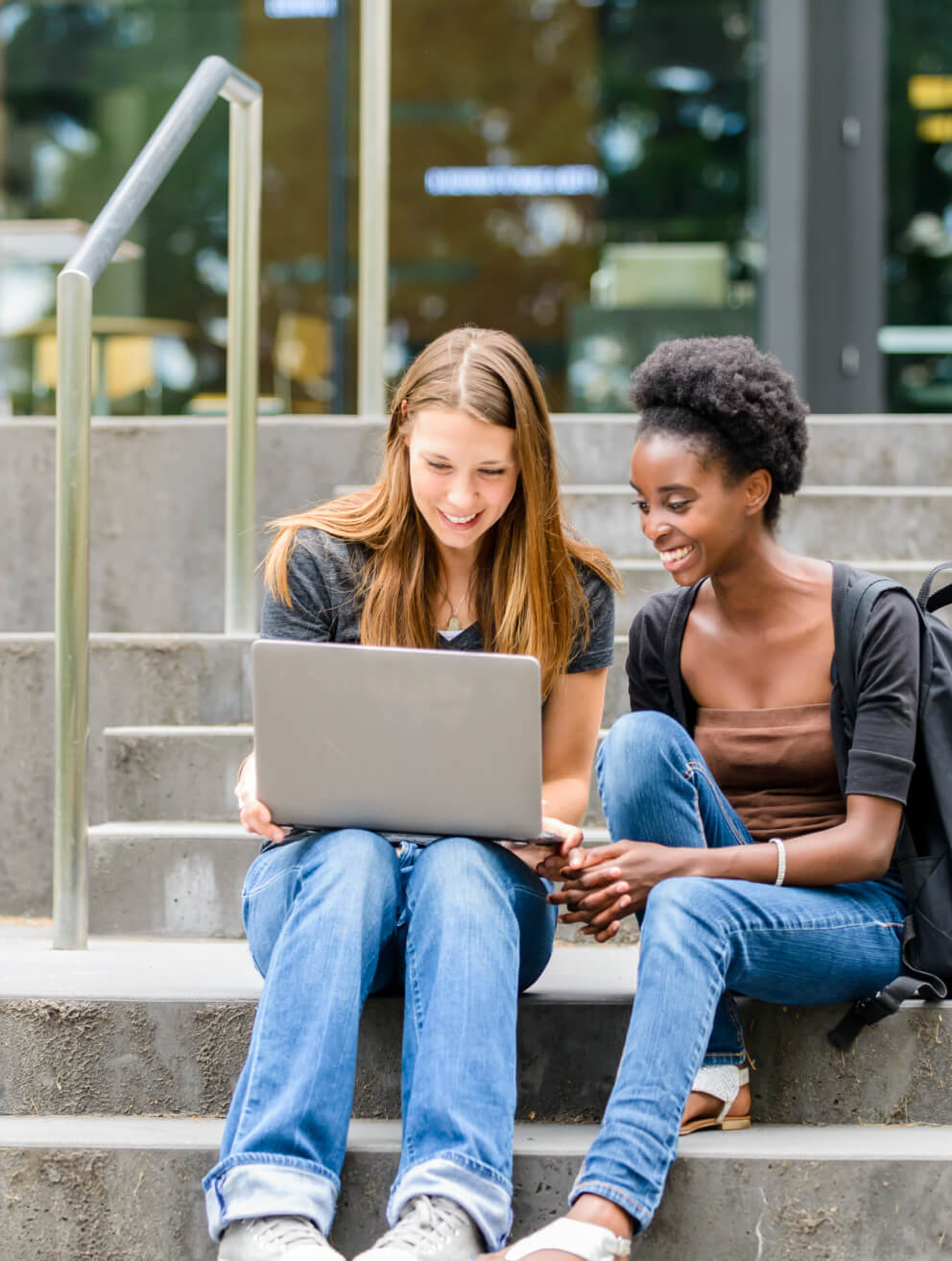 two female students looking at computer