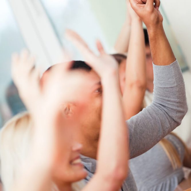 students raising hands