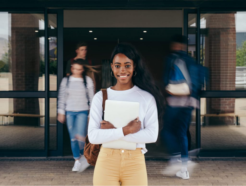young student holding a book
